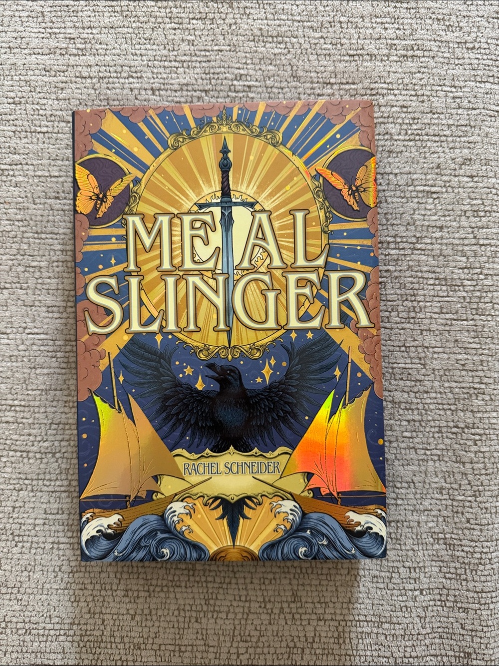 Metal Slinger by Rachel Schneider — Decorative Hardcover in Gold and Navy